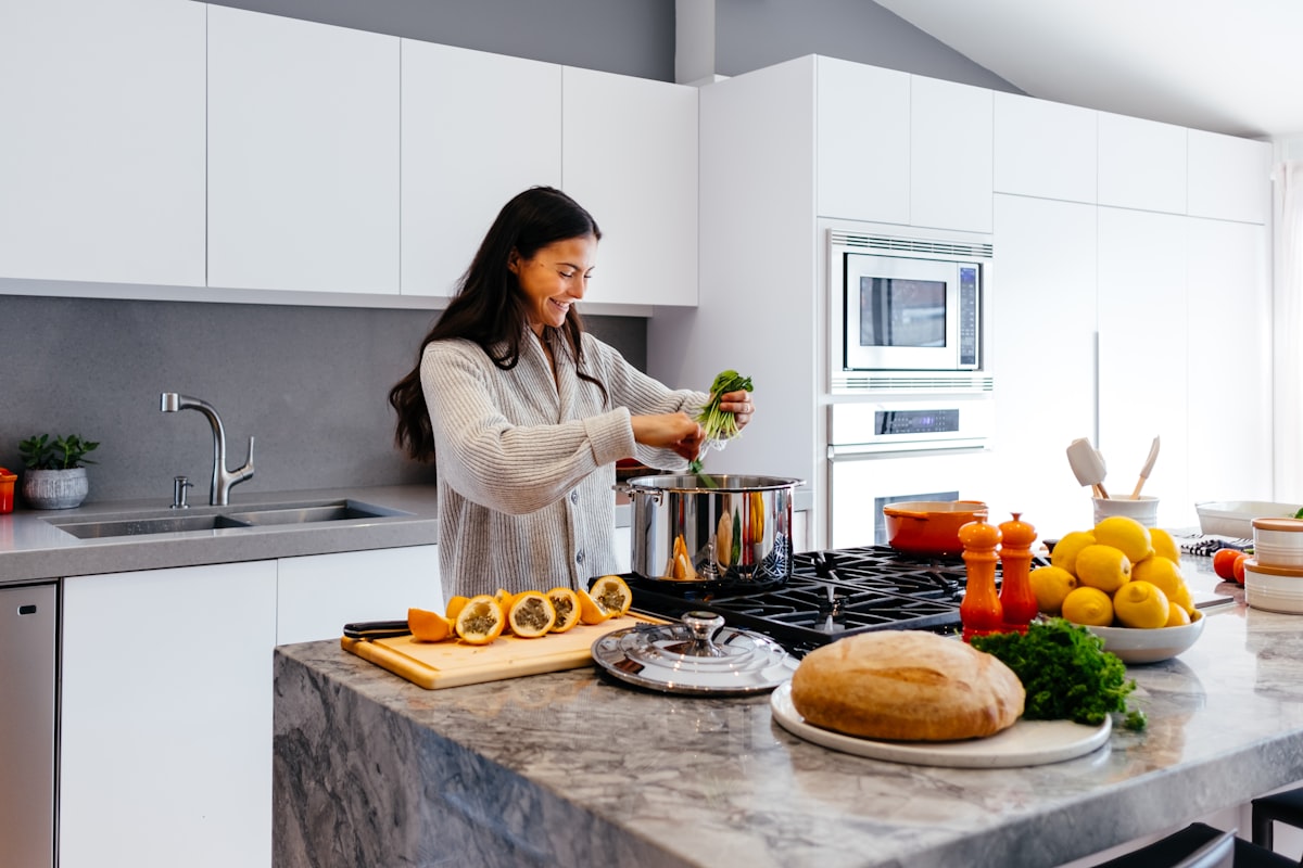 Instructor demonstrating proper cutting technique in nutritious cooking class